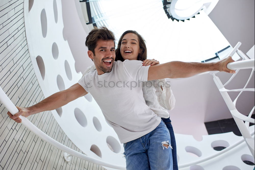 Similar – Young beautiful couple posing wearing jeans and t-shirt