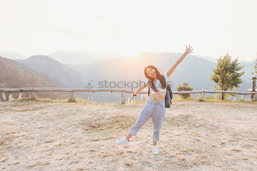 Similar – Stylish woman on picturesque landscape