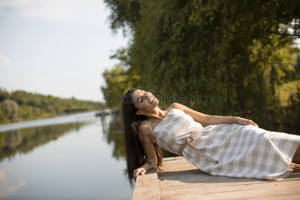 Similar – Image, Stock Photo Young woman in summer dress sitting on the banks of the Rhine with her feet in the river