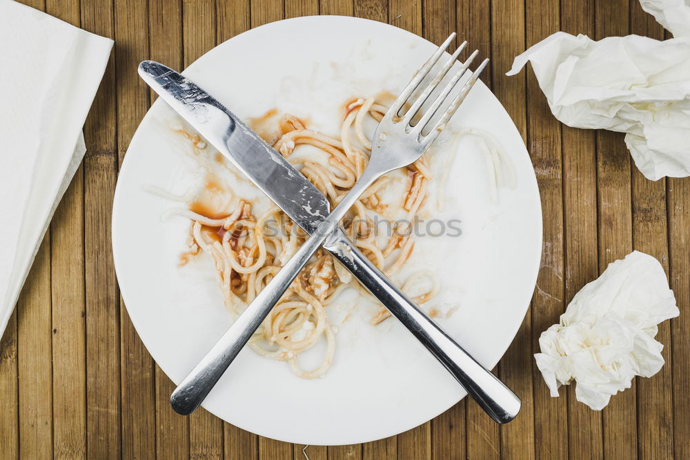 Similar – Octopus in a Greek restaurant. Hands are cutting octopus.