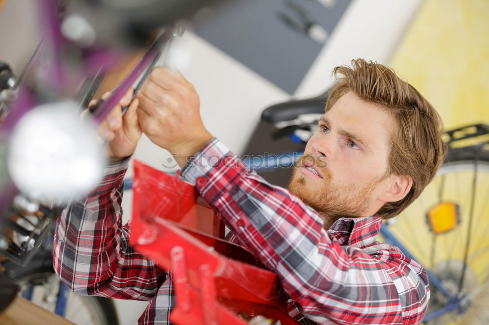 Similar – Man working on bike