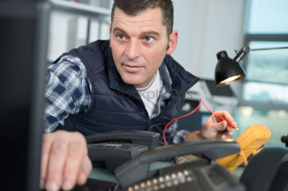 Similar – Image, Stock Photo Mechanic checking wheel of a customized motorcycle