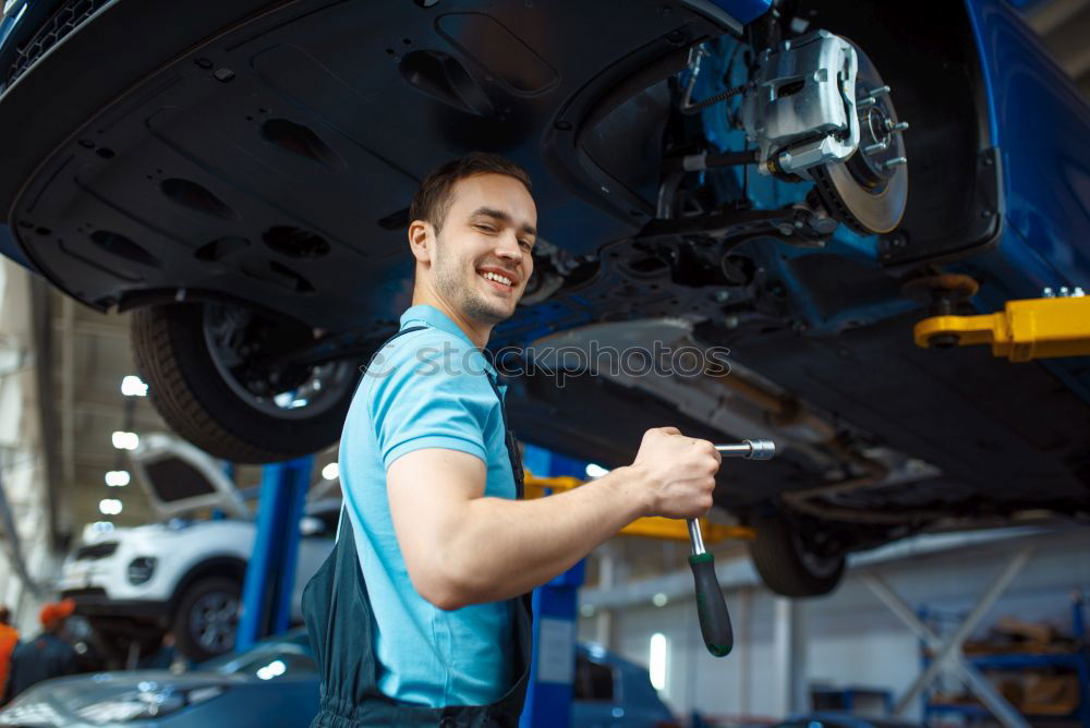 Professional Mechanic Repairing Car.