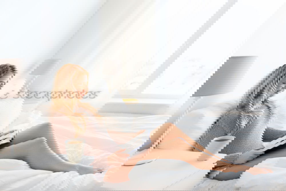 Similar – Image, Stock Photo Soft photo of a woman on the bed with an old book and a cup of coffee