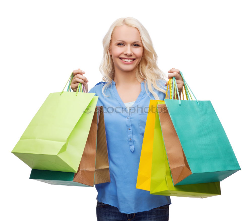 Similar – Shopping bags on womans hand. Woman shopping with colored paper bags.