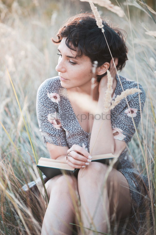 Similar – pretty young woman reading a book