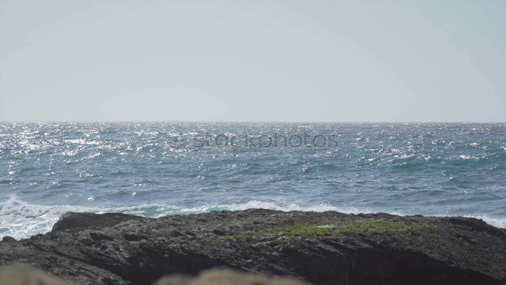 Similar – Waves of the Atlantic break foaming at the coast of Ireland