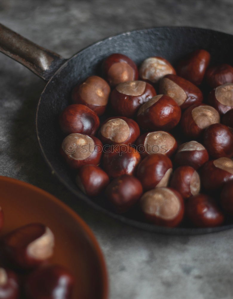 Similar – Image, Stock Photo Fried chestnuts in bowl on the kitchen table