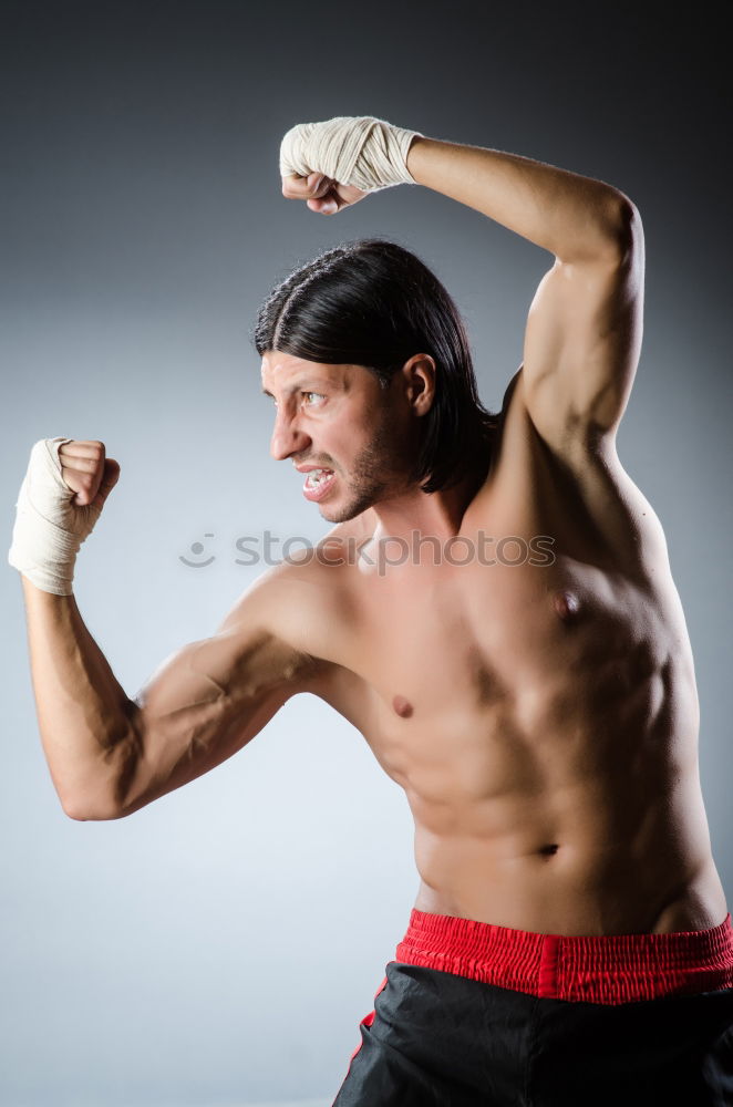 Similar – Image, Stock Photo Young thai boxing man is doing a workout for fight