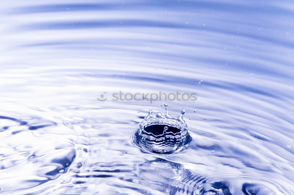 Similar – Ocean Water Strikes and Wraps Around Glass Ball