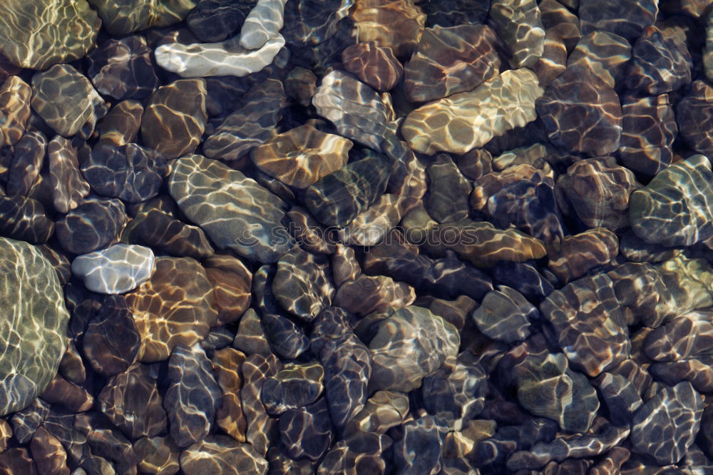 Similar – lighted stone beach Water