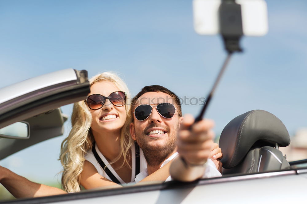 Similar – Young couple doing a selfie on the car