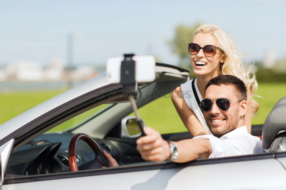 Similar – Young couple doing a selfie on the car