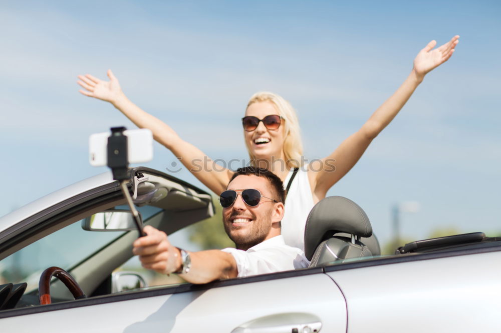 Similar – Young couple doing a selfie on the car