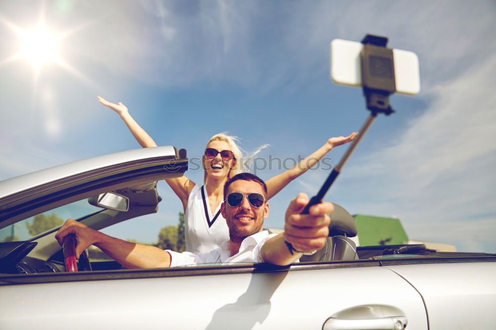 Similar – Young couple doing a selfie on the car