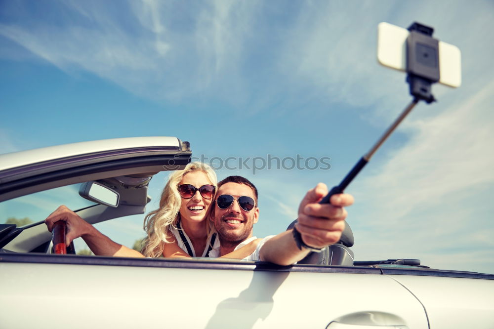 Similar – Young couple doing a selfie on the car