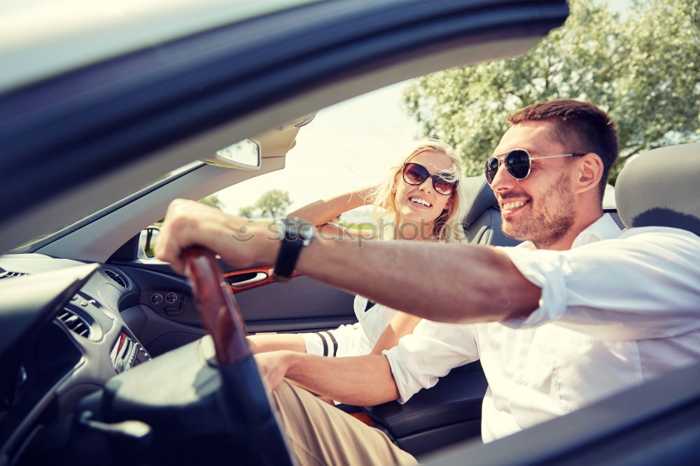 Similar – father teaching kid daughter to drive a car