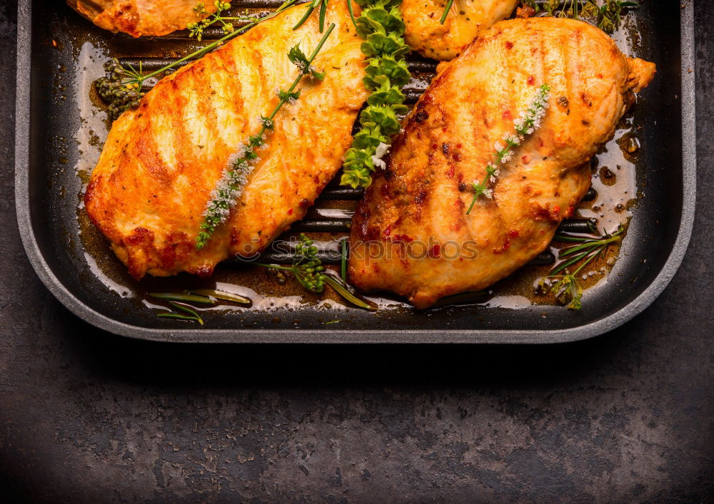 Similar – Image, Stock Photo Fried chicken breast in grill pan with fresh herbs