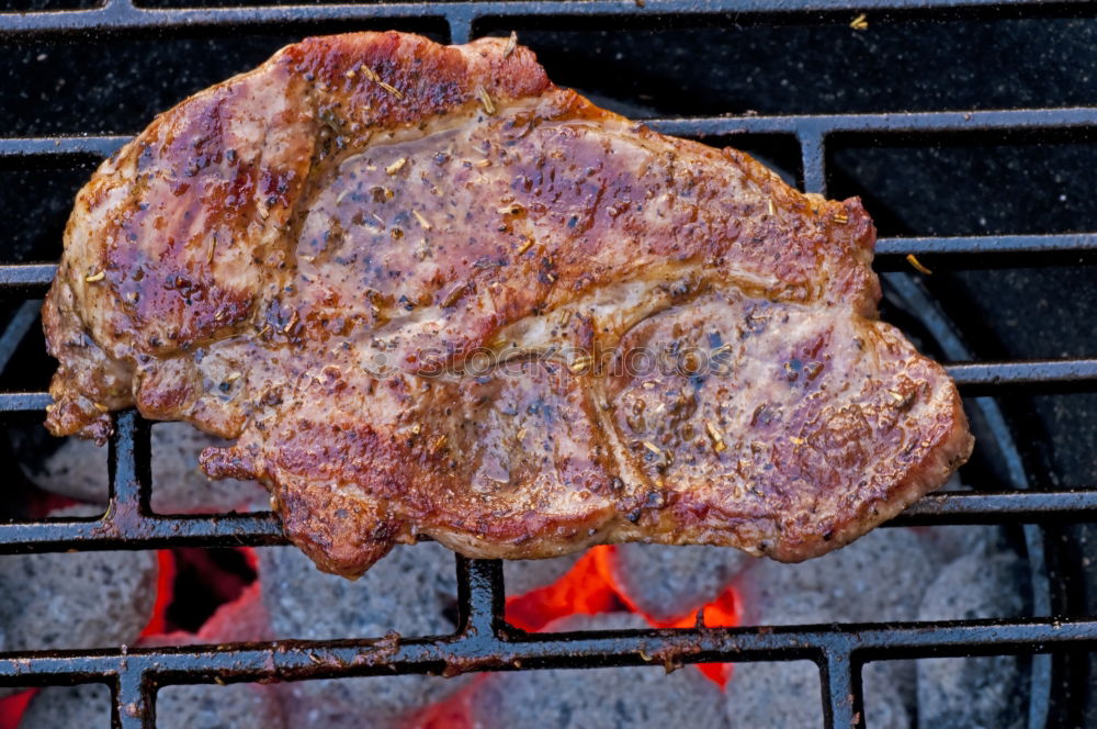 Similar – Image, Stock Photo Juicy steaks on the charcoal grill