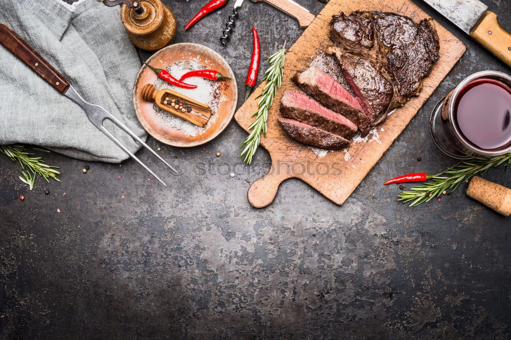 Image, Stock Photo Sliced grill steak on cutting board with wine and spices