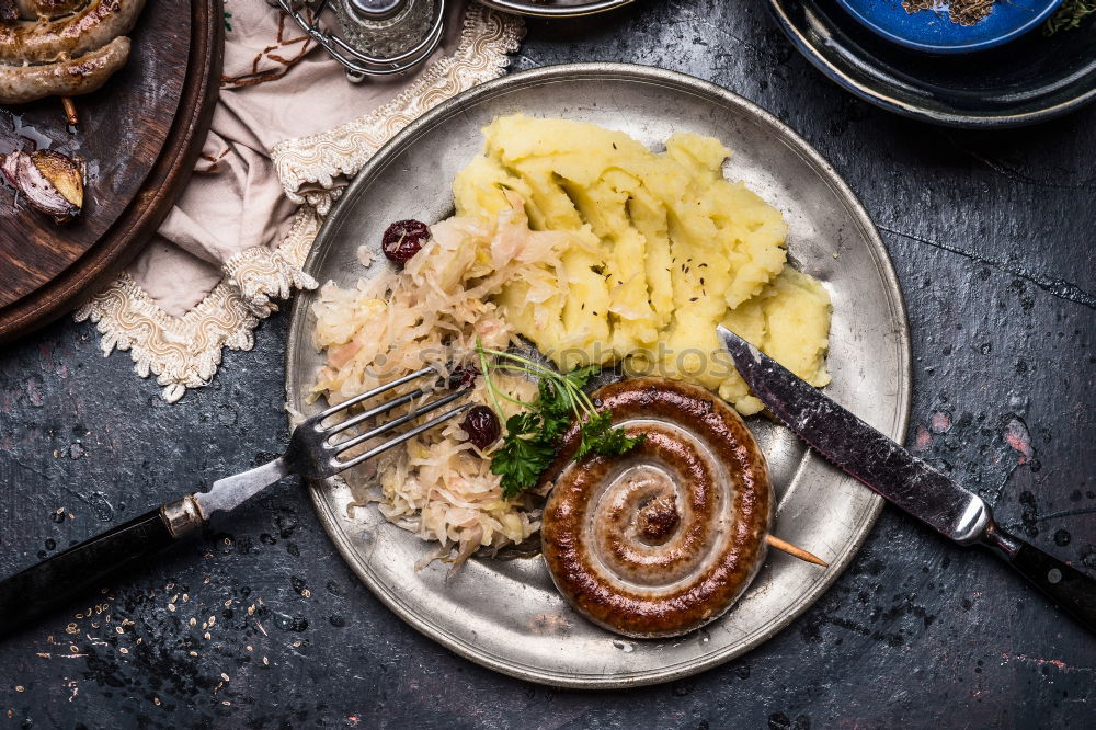 Image, Stock Photo Fried sausage with potatoes and sauerkraut