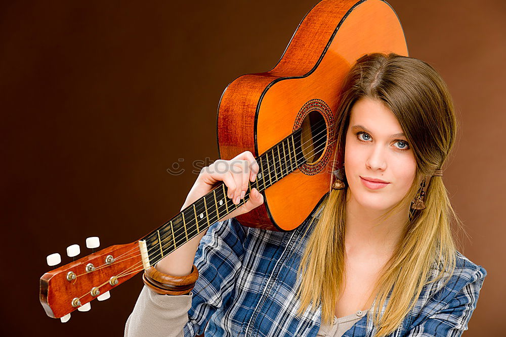 Similar – Image, Stock Photo Vibration | guitar pages. Young woman holding guitar