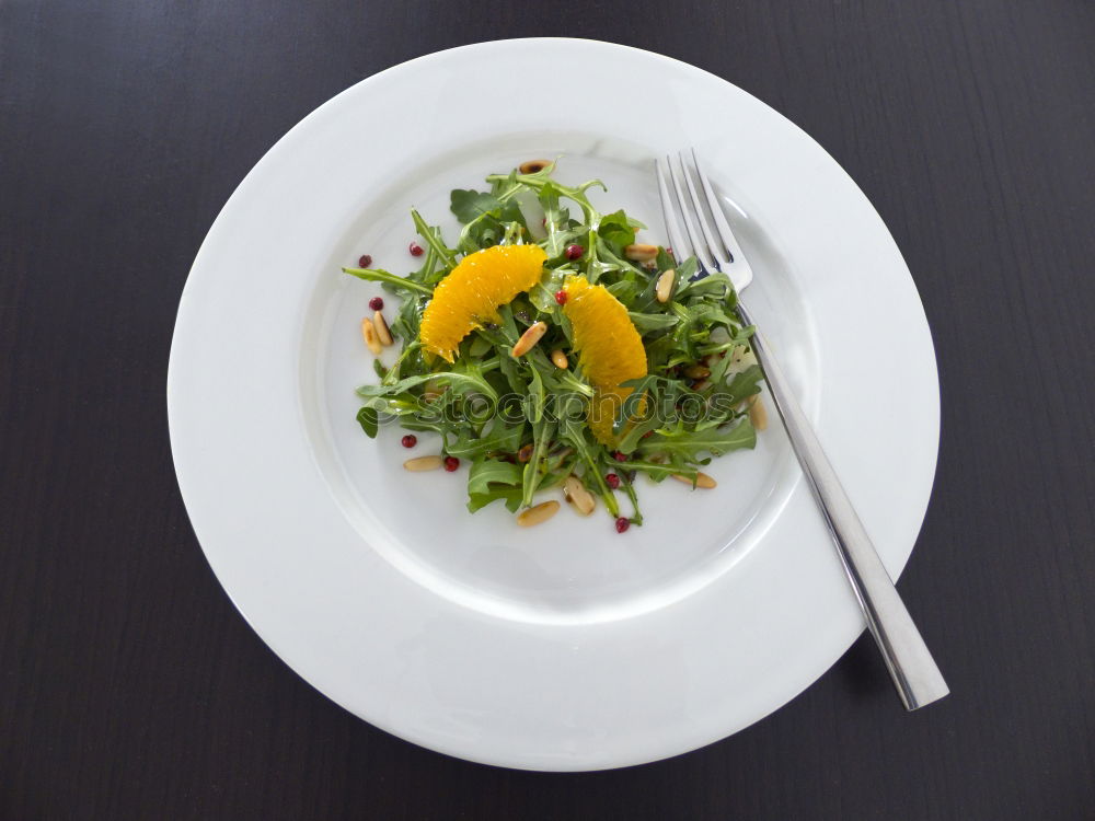 Similar – fresh salad on dark wooden table