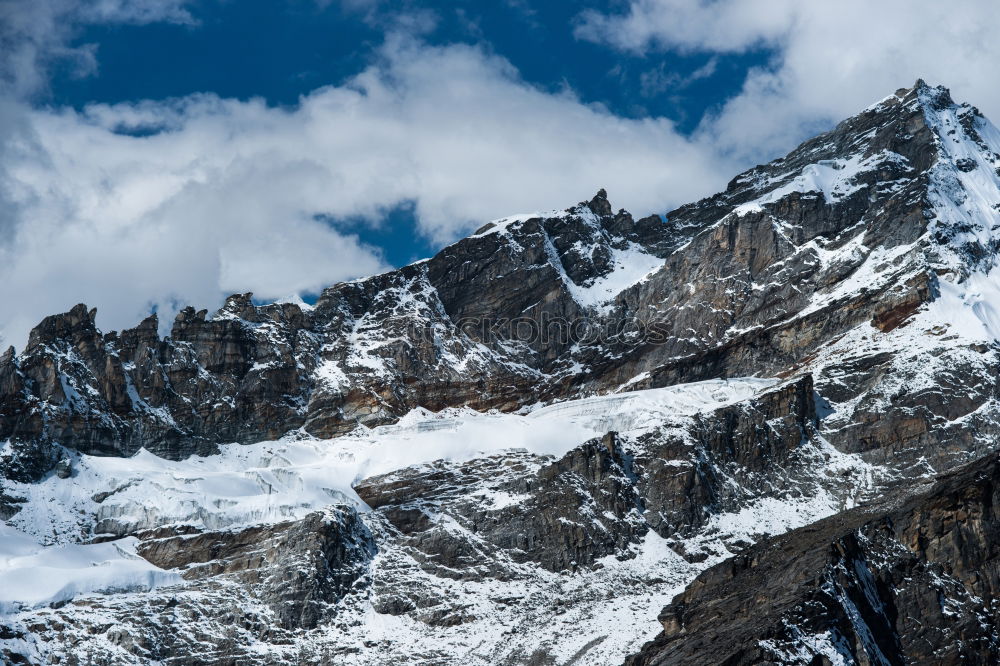 Similar – Man walking in snowy mountains