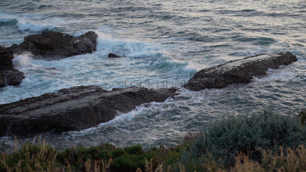 Similar – Waves of the Atlantic break foaming at the coast of Ireland