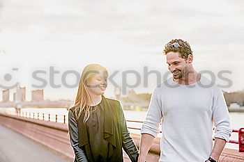 Similar – Image, Stock Photo Happy couple talking sitting near River Thames