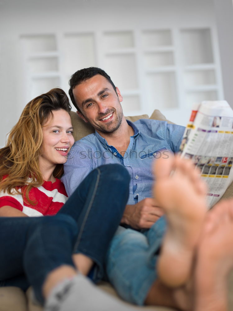 Similar – Image, Stock Photo Young couple reading book on couch at home