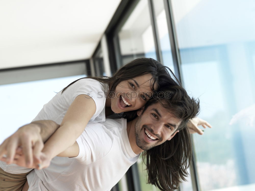 Similar – Smiling couple of lovers having fun.