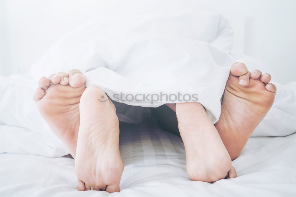 Similar – Image, Stock Photo Woman’s legs in bed on the white wall