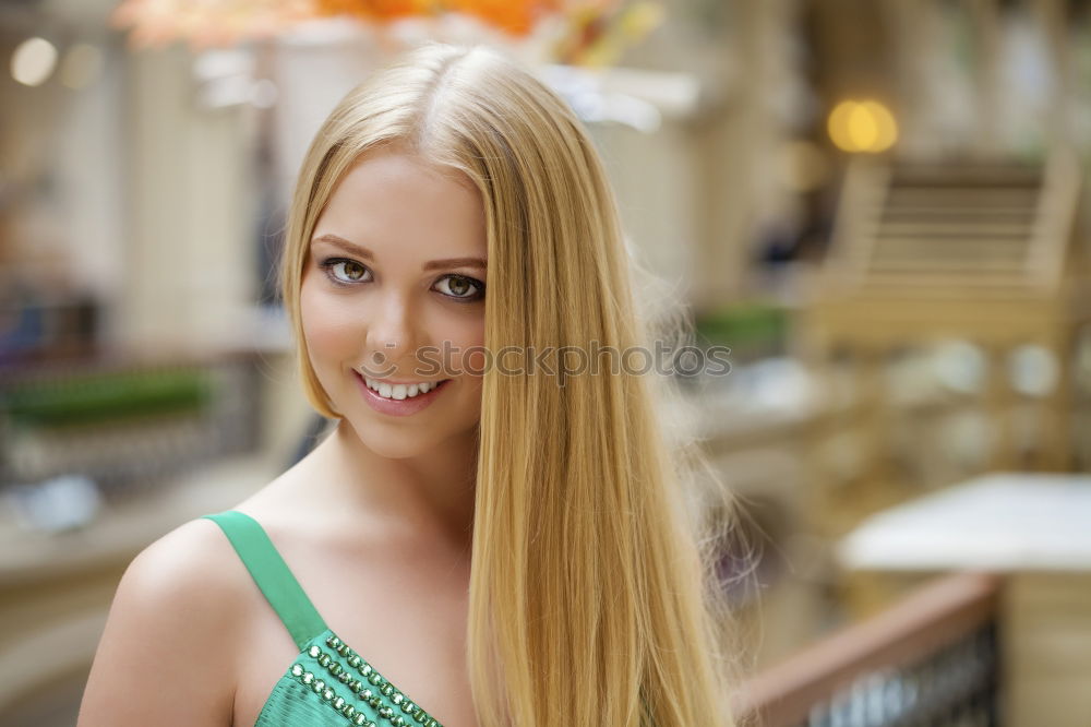 Similar – Young woman smiling in urban background.