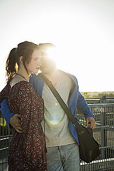 Similar – Bearded man carrying her girlfriend in a piggyback way outdoors at sunset.