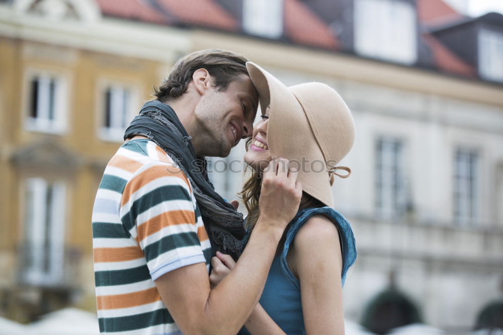 Similar – Young couple embracing and laughing outdoors under umbrella