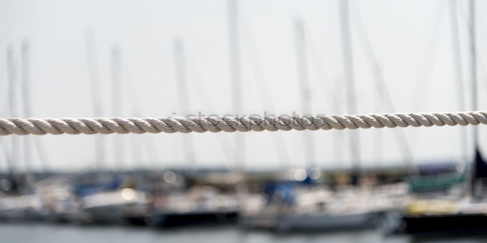 Similar – Fenders suspended between a boat and dockside for protection. Maritime fenders