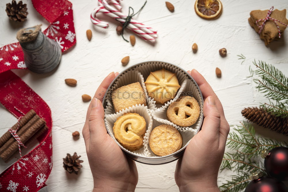 Image, Stock Photo Woman holding cookies box above christmassy table