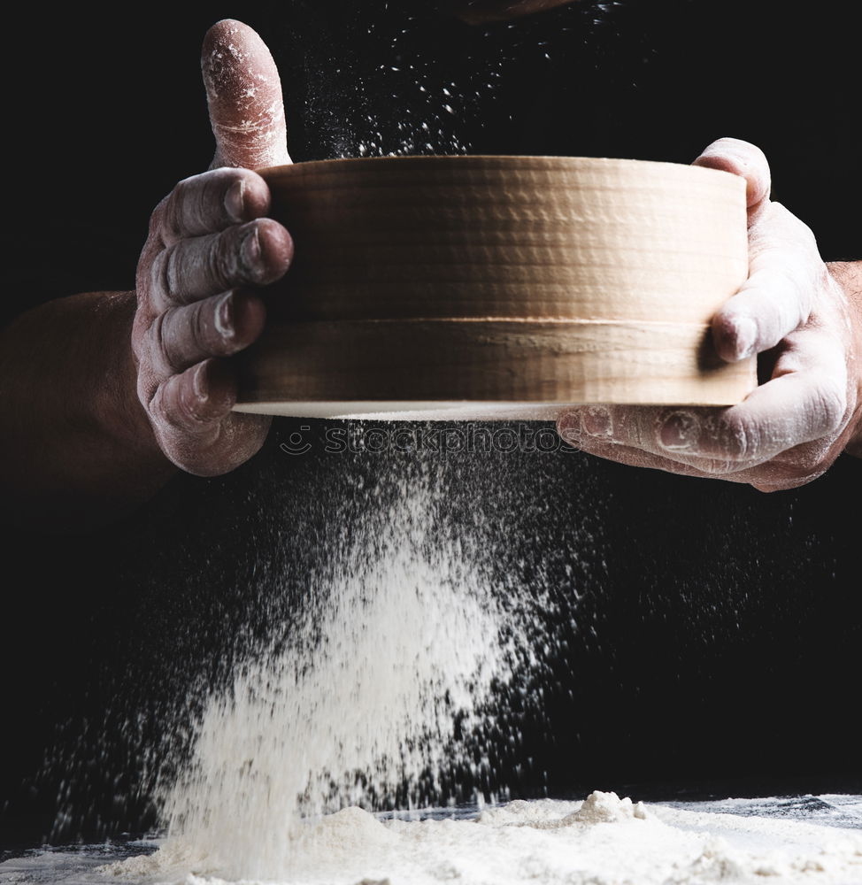 Similar – Image, Stock Photo white wheat flour in male hands, black background