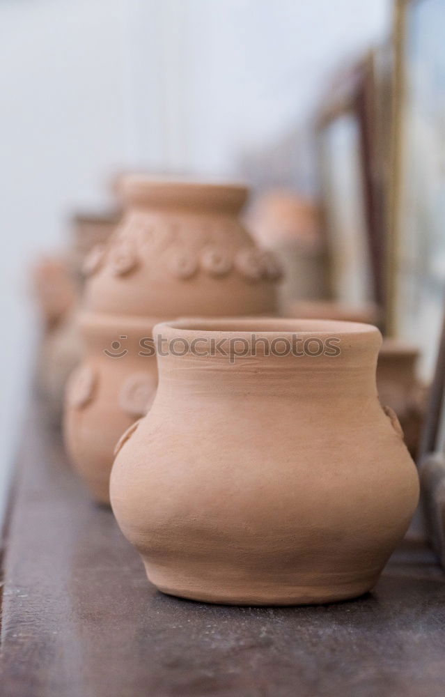 Similar – Image, Stock Photo Close-up of clay vase on wheel