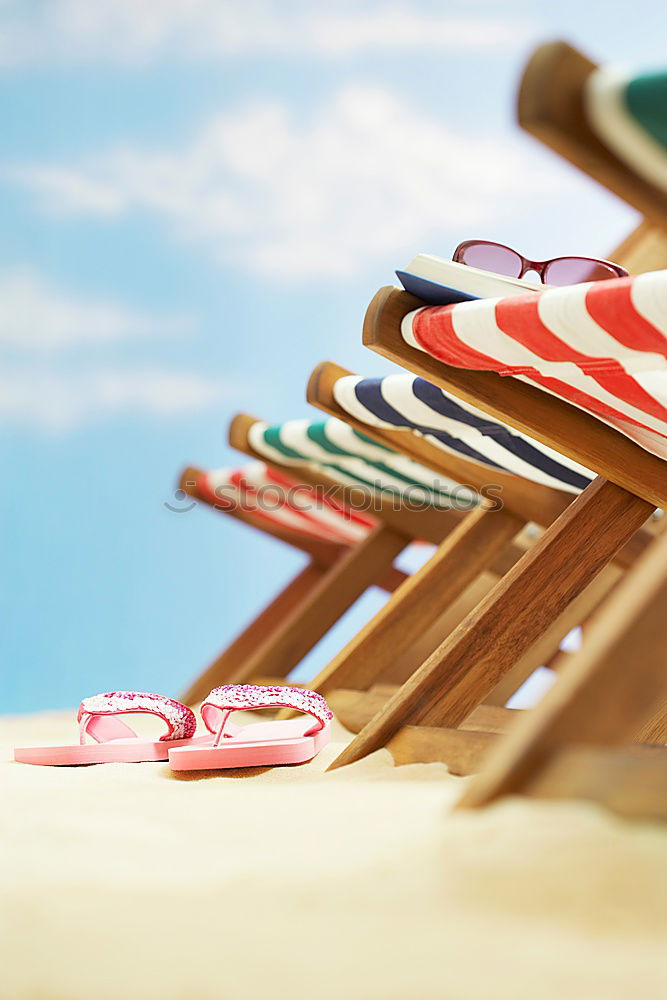 Similar – Image, Stock Photo Towel, beach ball, sunscreen and water gun on the beach