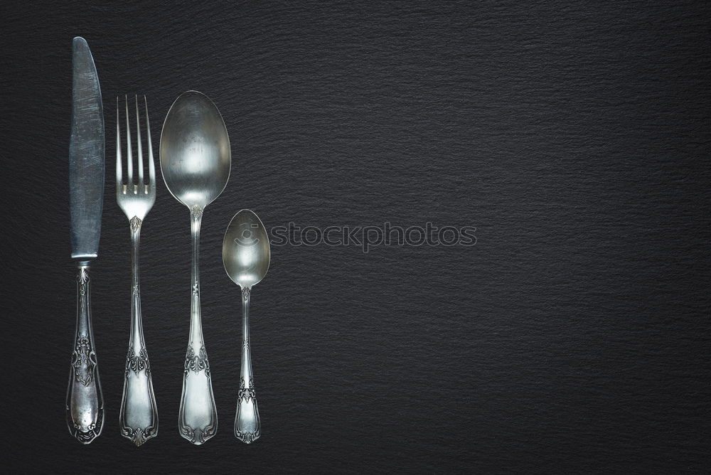 Image, Stock Photo Wooden background with vintage spoons and forks