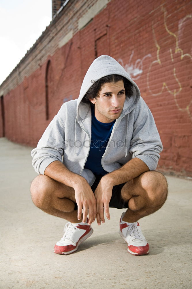 Similar – Image, Stock Photo Young sports man sitting at staircase with water bottle break