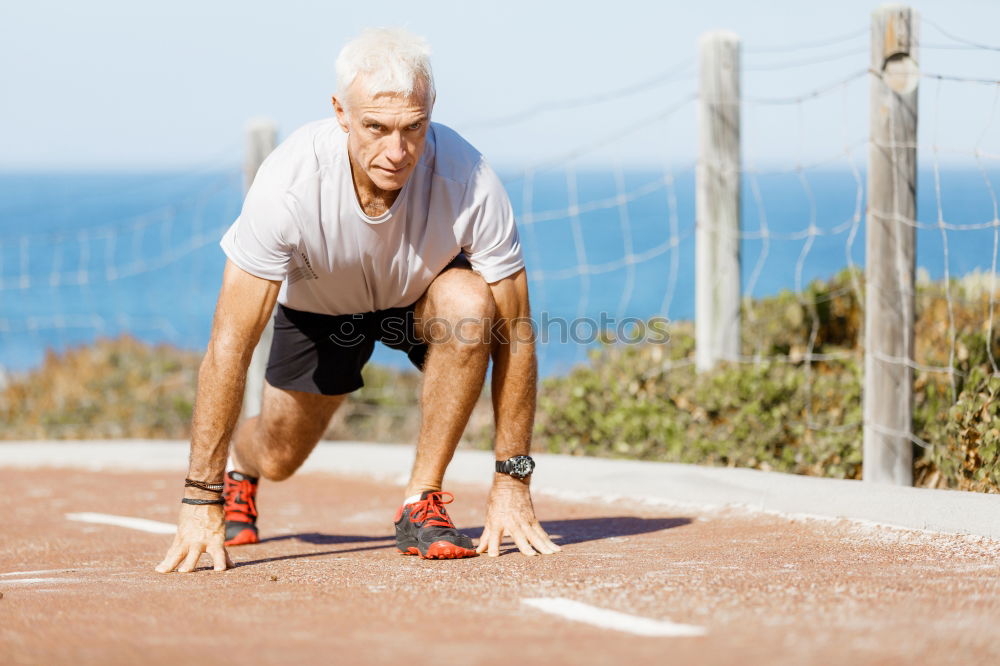 Similar – Black man doing stretching after running in urban background