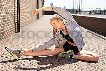 Similar – Woman stretching her body in front of ancient wall in park