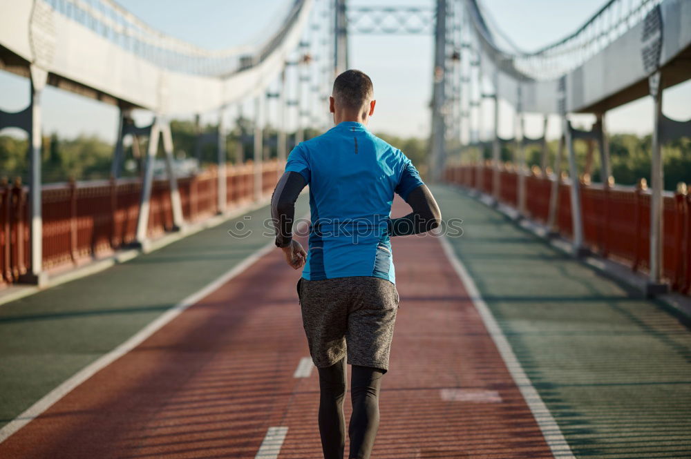 Similar – Image, Stock Photo young runner man athlete at the race track. Sports outdoors