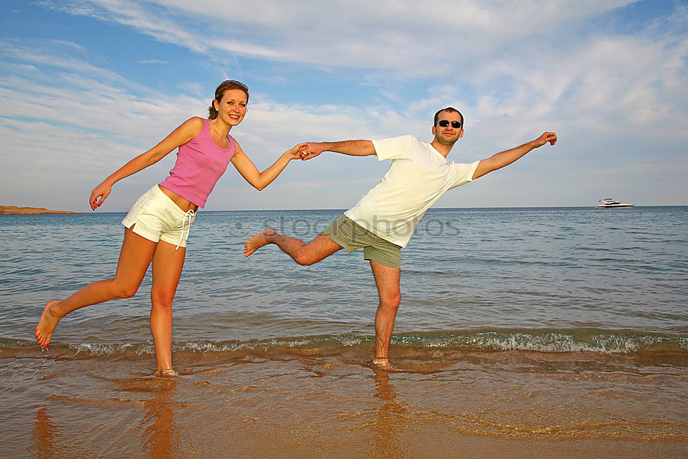 Similar – Father and son playing on the beach at the day time. They are dressed in sailor’s vests and pirate costumes. Concept of happy game on vacation and friendly family.