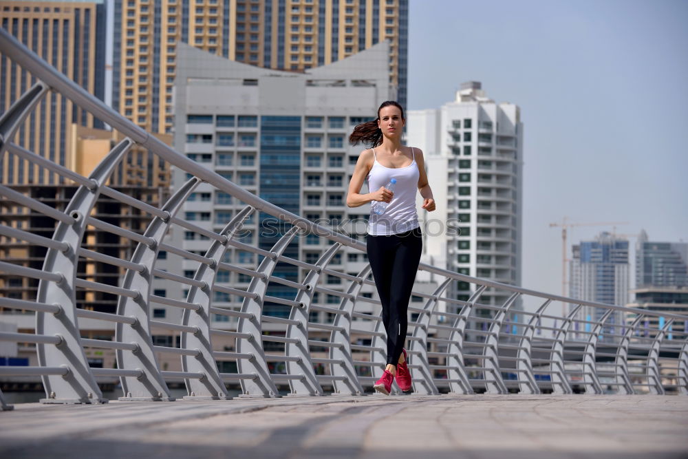 Similar – young woman runner eating an apple