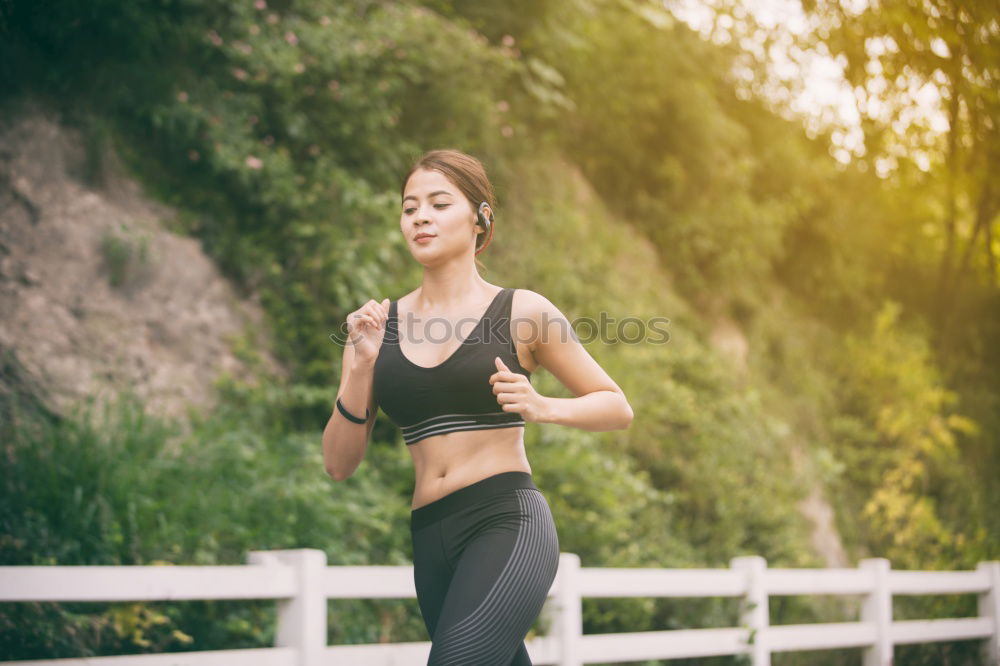 Similar – Young sporty woman jogging