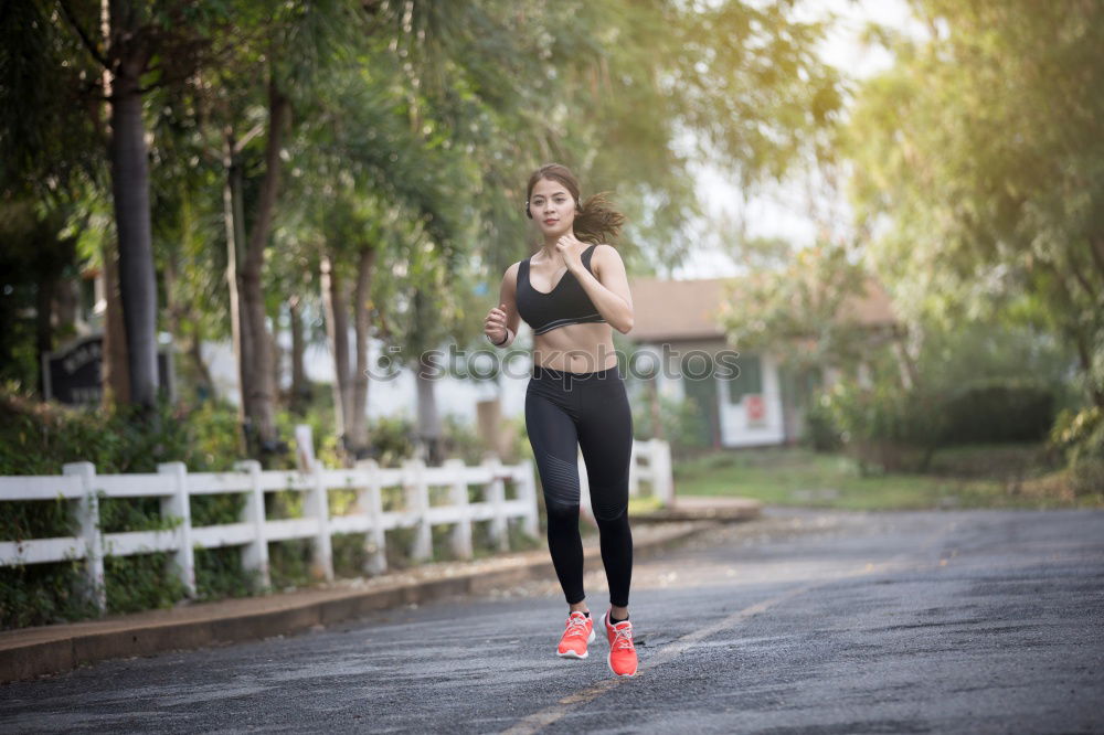 Similar – Image, Stock Photo Woman athlete with ache in her back while running